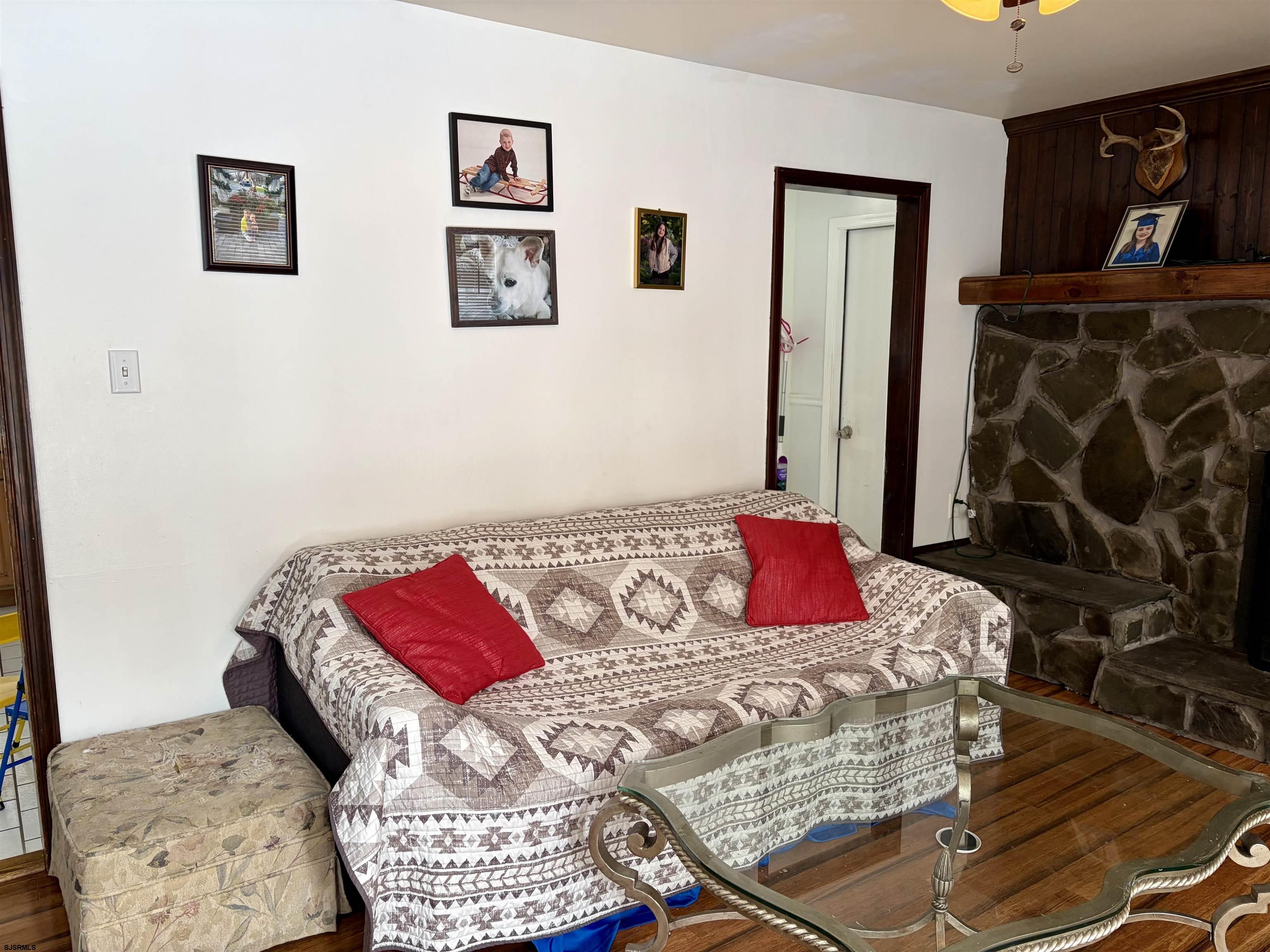 155 Chestnut Street Woodbine, NJ 08270 - Photo 2 of 18 a bedroom with a bed and a couch