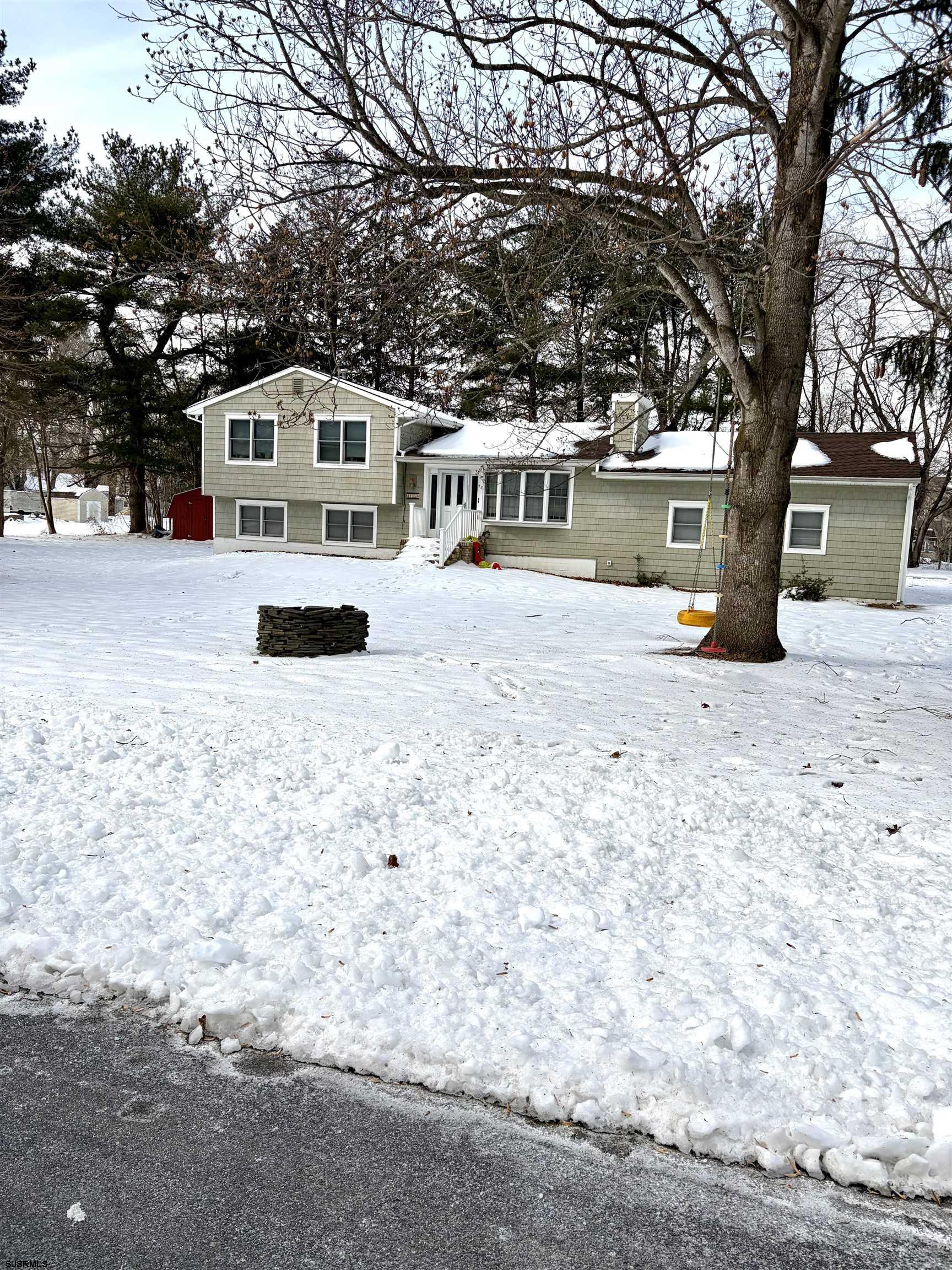 155 Chestnut Street Woodbine, NJ 08270 - Photo 4 of 18 a view of a house with a yard