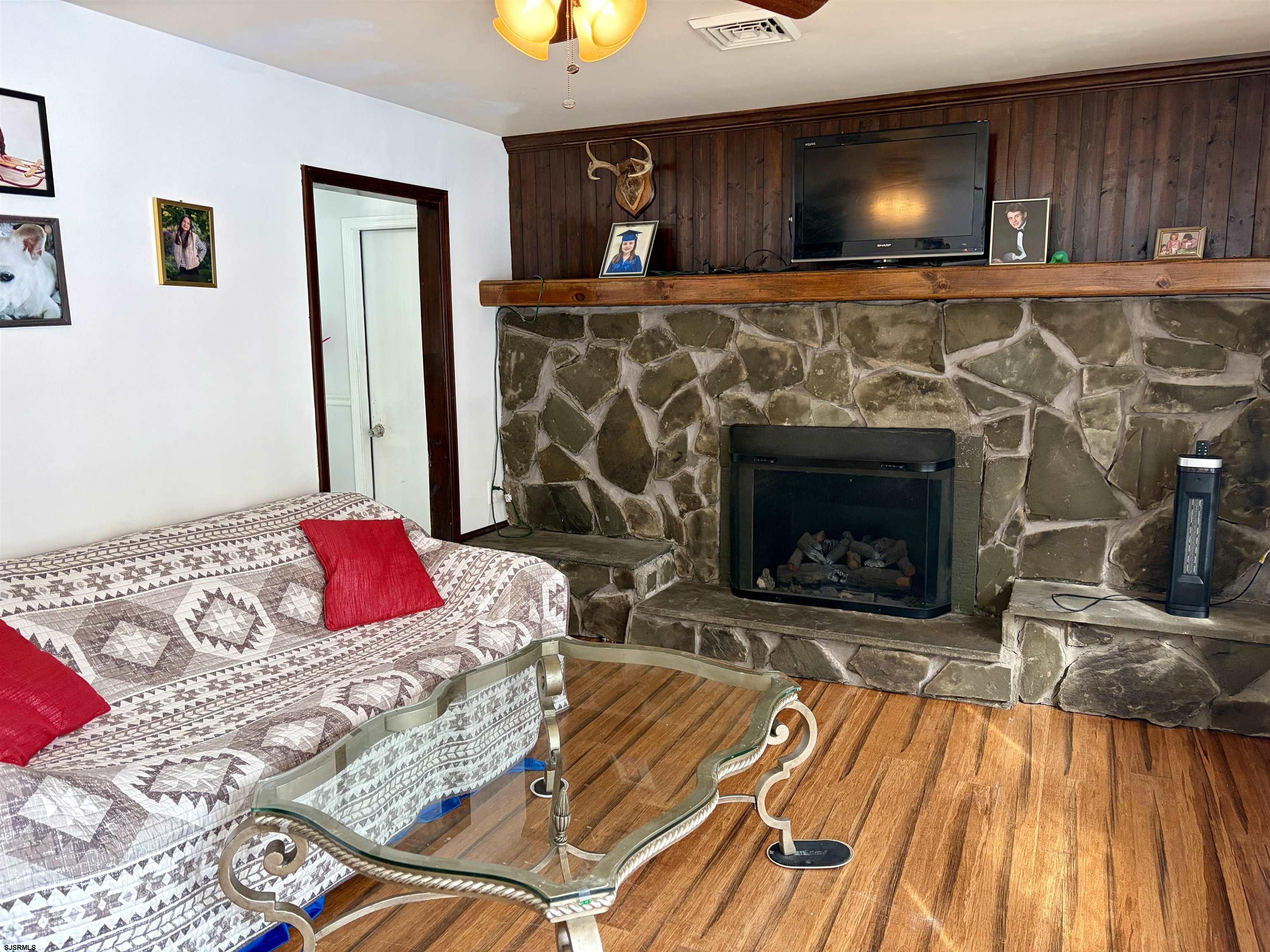 155 Chestnut Street Woodbine, NJ 08270 - Photo 7 of 18 a living room with a couch and a fireplace