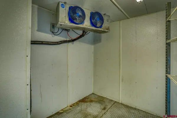 walk in closet with wooden floor