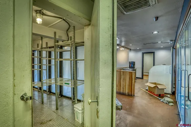 a view of a bathroom with a shower curtain