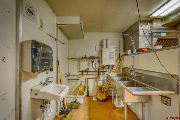a bathroom with a sink mirror and vanity