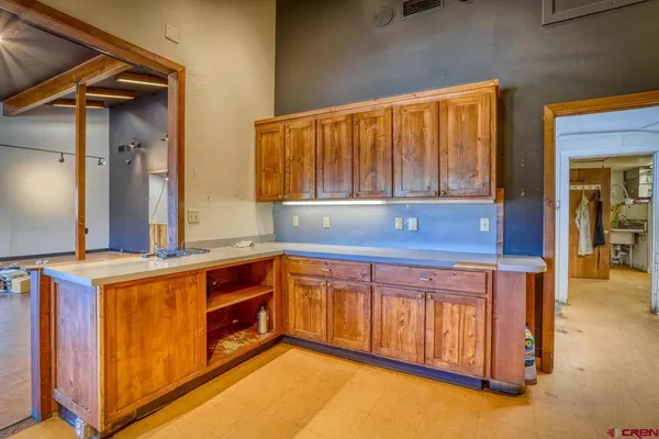 a view of a brick house with a large window