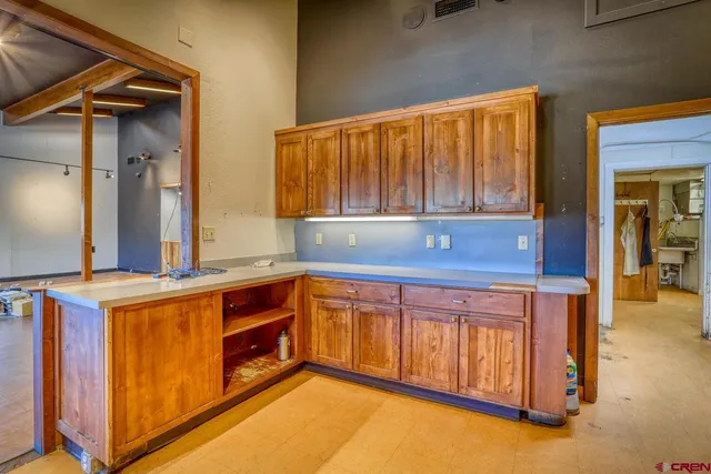 a view of a brick house with a large window
