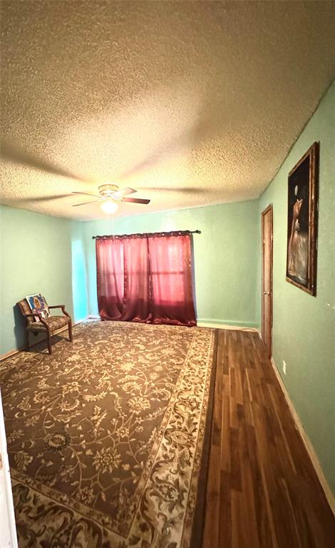 238 South 8th Street Jacksboro, TX 76458 - Photo 5 of 9 a bedroom with a bed and a window