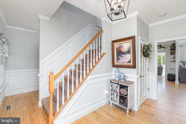 a kitchen with a sink a stove and chairs