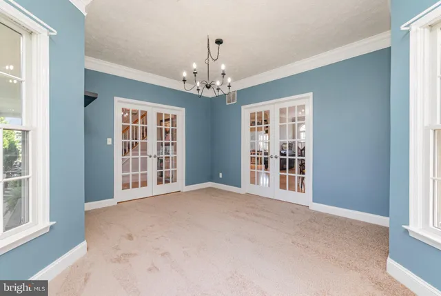 a kitchen with kitchen island a counter top space cabinets and stainless steel appliances