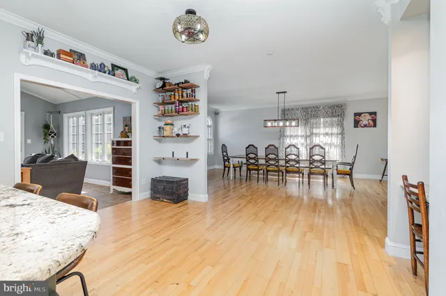 a view of a bathroom with a sink a mirror and a shower