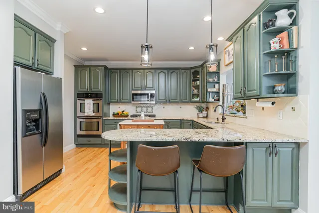 a view of a hallway with wooden floor and closet area