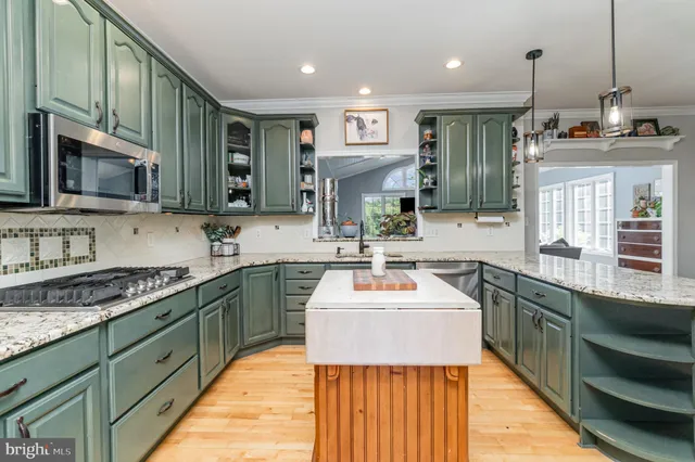 a view of a walk in closet and bathroom