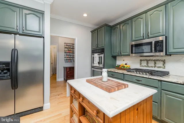 a bathroom with a shower sink and mirror