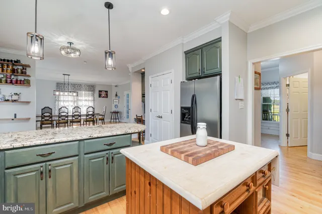 a spacious bathroom with a double vanity sink mirror and a bathtub