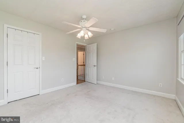 an aerial view of a house with a yard basket ball court