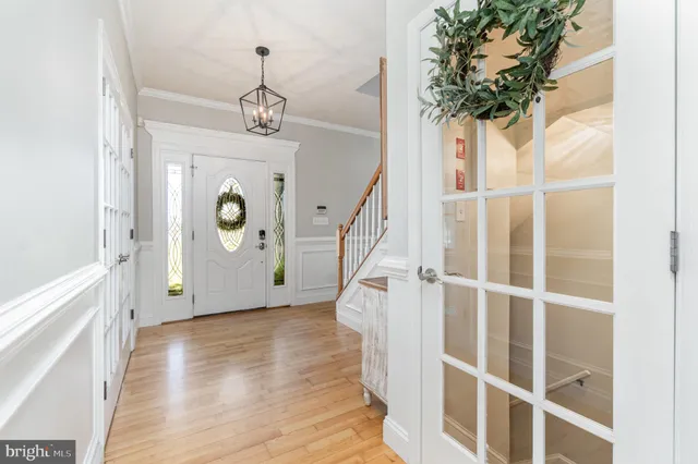 a kitchen with stainless steel appliances granite countertop a sink and a refrigerator