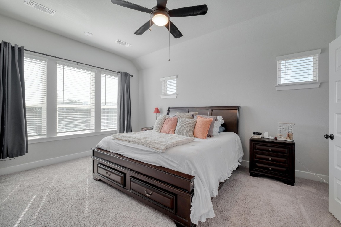 1113 Dog Iron Street Georgetown, TX 78633 - Photo 15 of 33 a bed sitting in a bedroom next to a window