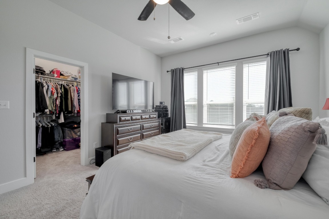 1113 Dog Iron Street Georgetown, TX 78633 - Photo 16 of 33 a bedroom with a bed and a large window