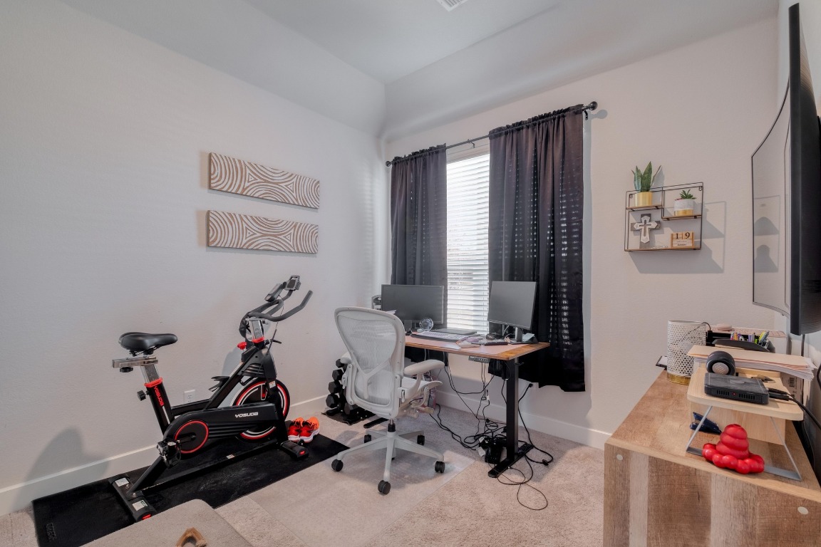 1113 Dog Iron Street Georgetown, TX 78633 - Photo 20 of 33 a view of a workspace with gym equipment