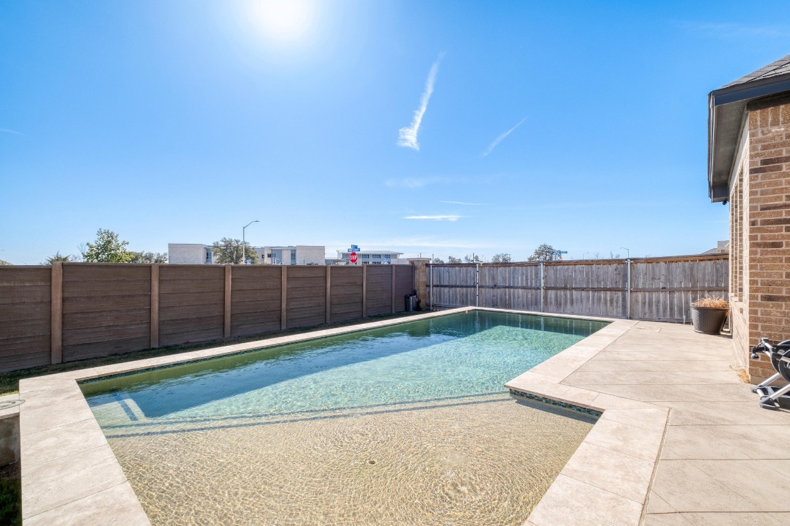 1113 Dog Iron Street Georgetown, TX 78633 - Photo 24 of 33 a view of a backyard with wooden fence