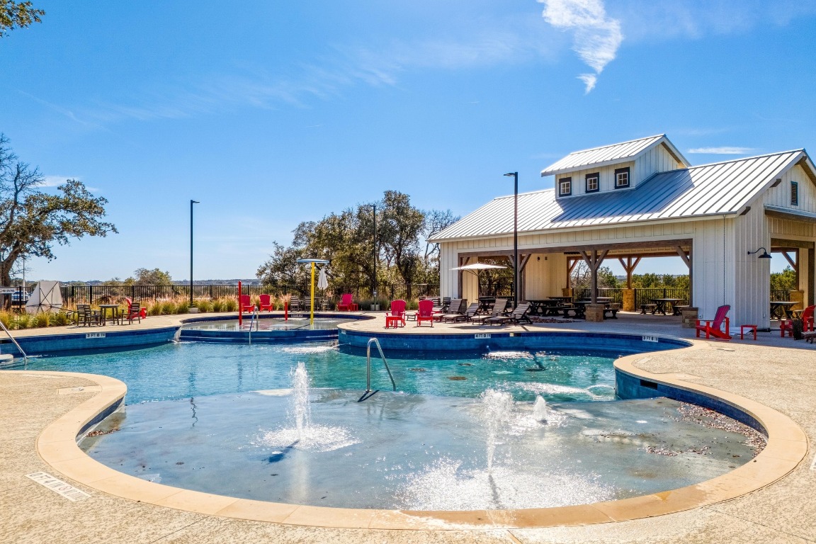 1113 Dog Iron Street Georgetown, TX 78633 - Photo 29 of 33 a view of a swimming pool with outdoor seating
