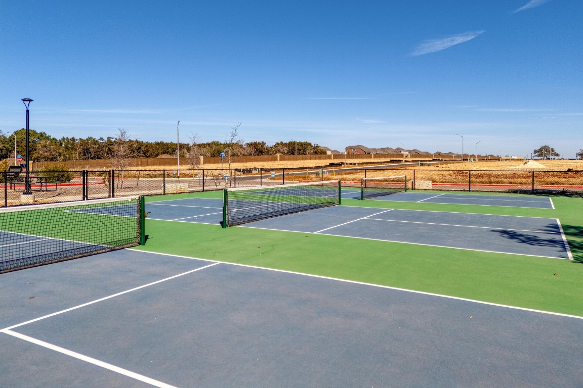 1113 Dog Iron Street Georgetown, TX 78633 - Photo 32 of 33 a view of tennis court