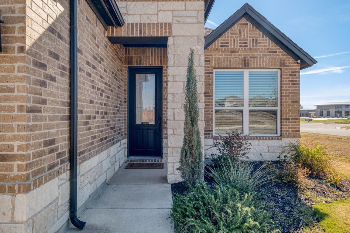 1113 Dog Iron Street Georgetown, TX 78633 - Photo 5 of 33 a front view of a house with a yard