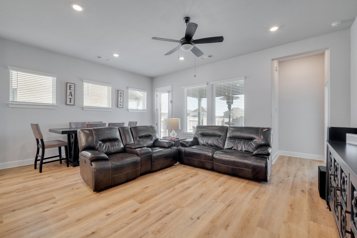 1113 Dog Iron Street Georgetown, TX 78633 - Photo 6 of 33 a living room with furniture and a wooden floor