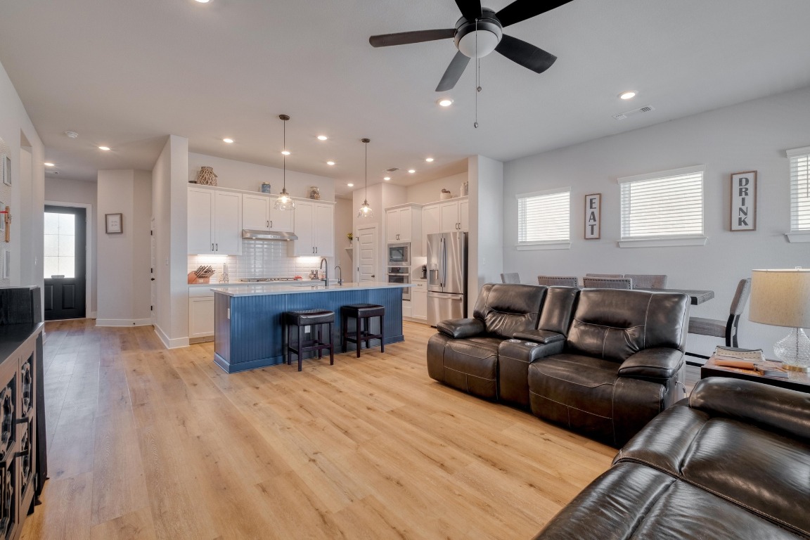 1113 Dog Iron Street Georgetown, TX 78633 - Photo 7 of 33 a living room with furniture and a dining table