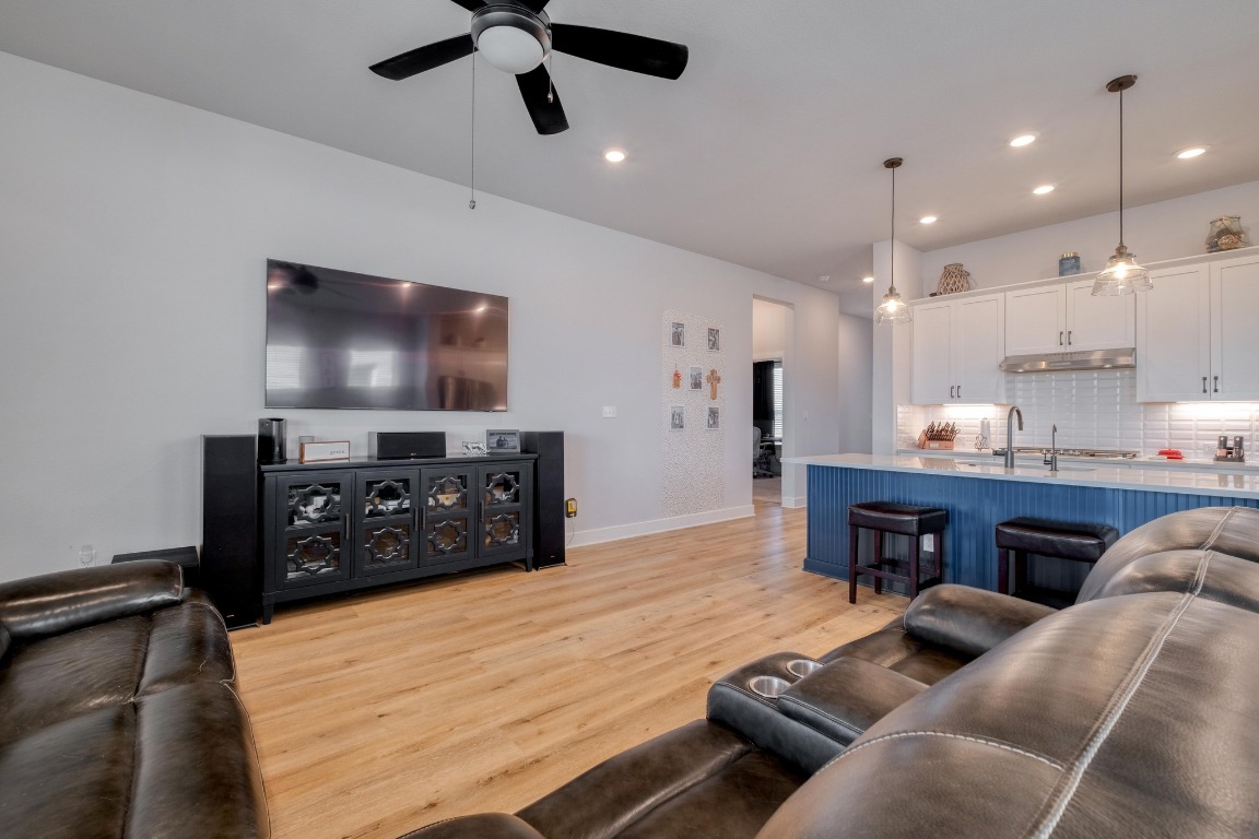 1113 Dog Iron Street Georgetown, TX 78633 - Photo 9 of 33 a living room with furniture and a flat screen tv