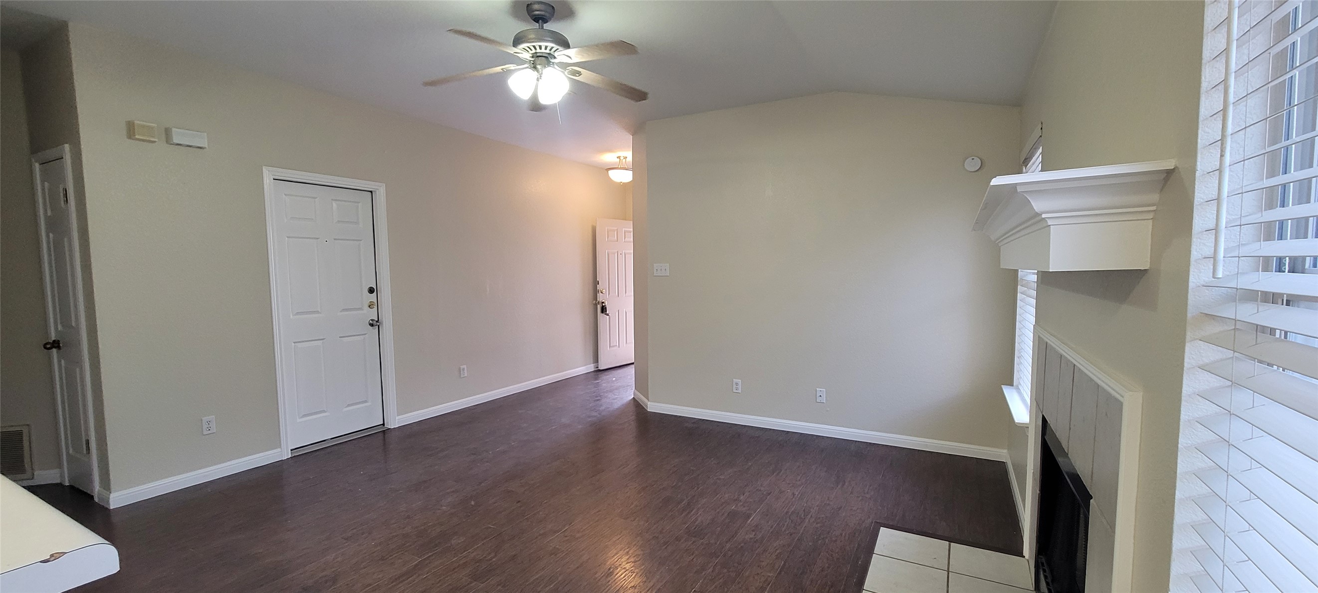 14612 Rumfeldt Street Austin, TX 78725 - Photo 3 of 9 wooden floor in an empty room with a window
