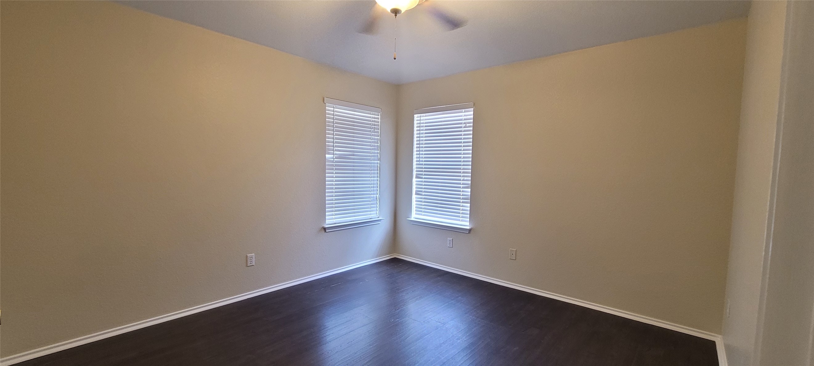 14612 Rumfeldt Street Austin, TX 78725 - Photo 7 of 9 a view of an empty room with wooden floor and a window