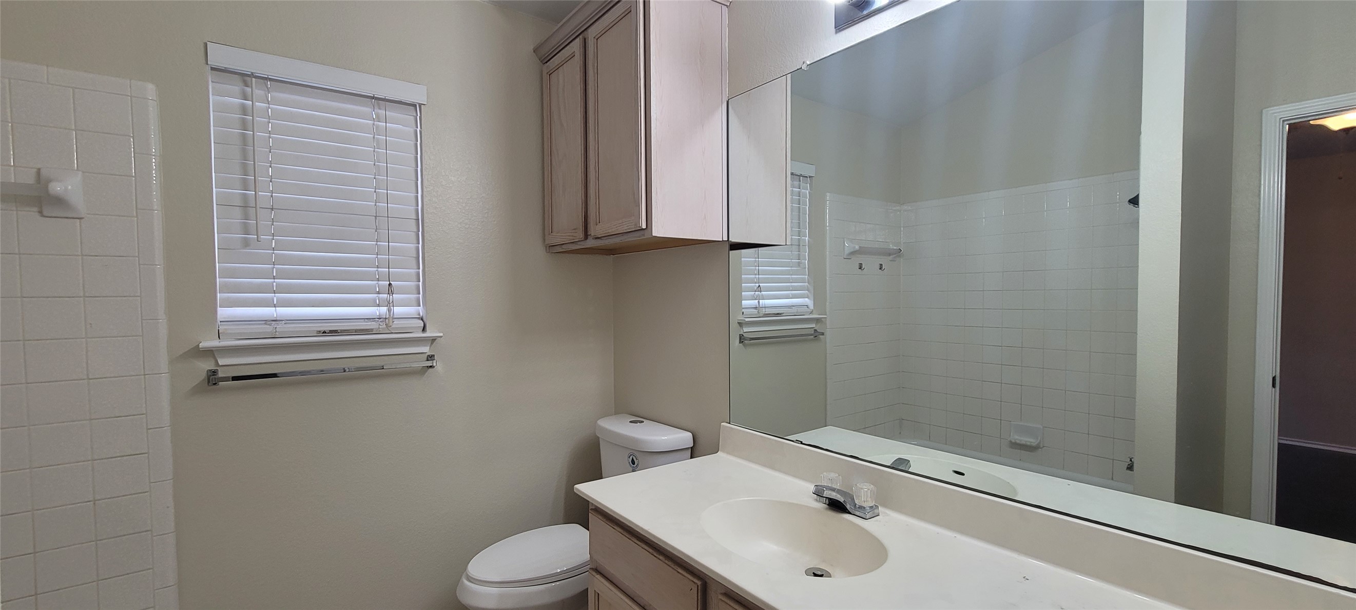 14612 Rumfeldt Street Austin, TX 78725 - Photo 9 of 9 a bathroom with a sink and a toilet