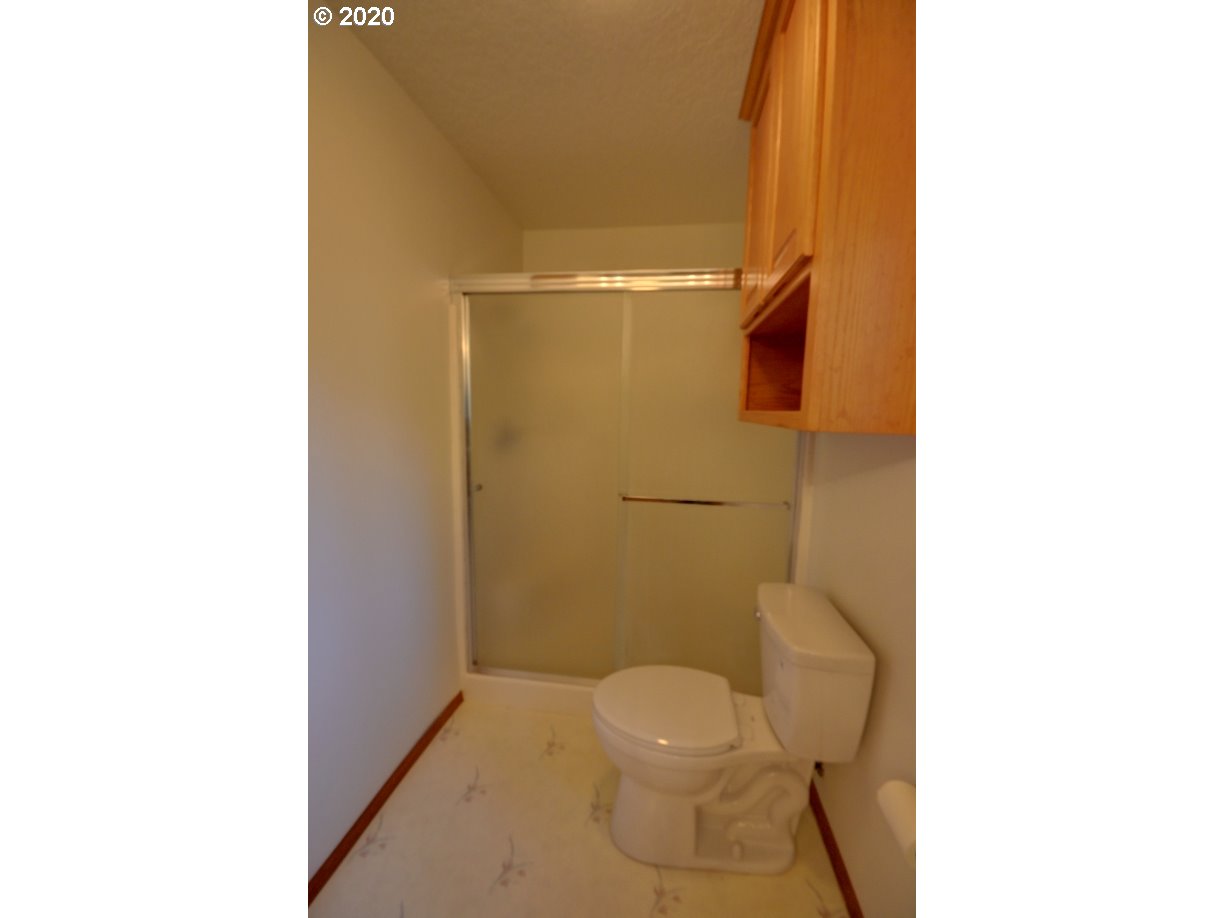 67051 East Barlow Trail Road Rhododendron, OR 97049 - Photo 16 of 32 a bathroom with a toilet and a shower