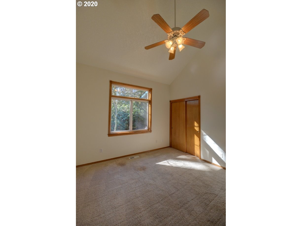 67051 East Barlow Trail Road Rhododendron, OR 97049 - Photo 17 of 32 a view of a room with a ceiling fan and a window