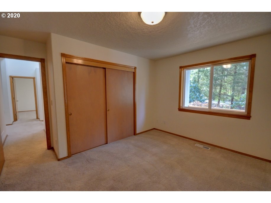 67051 East Barlow Trail Road Rhododendron, OR 97049 - Photo 18 of 32 a view of an empty room with a window