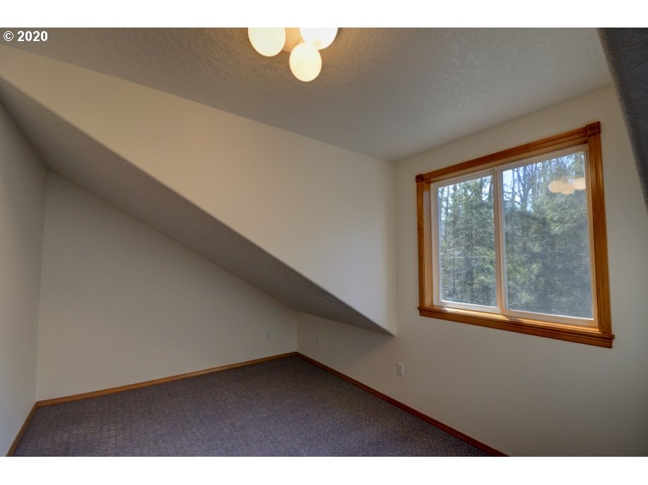 67051 East Barlow Trail Road Rhododendron, OR 97049 - Photo 23 of 32 a view of an empty room with a window