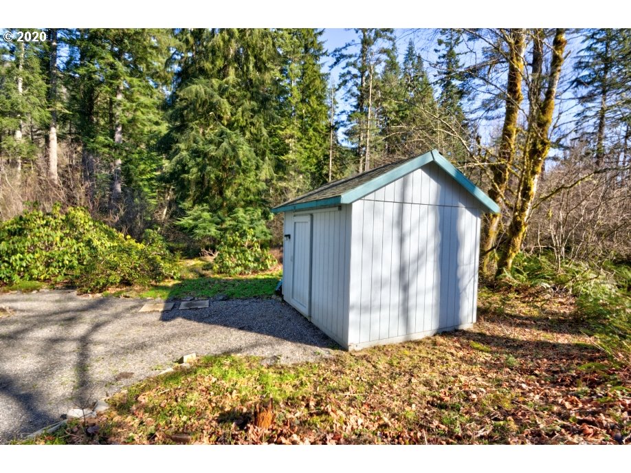 67051 East Barlow Trail Road Rhododendron, OR 97049 - Photo 29 of 32 a view of a wooden house with a yard