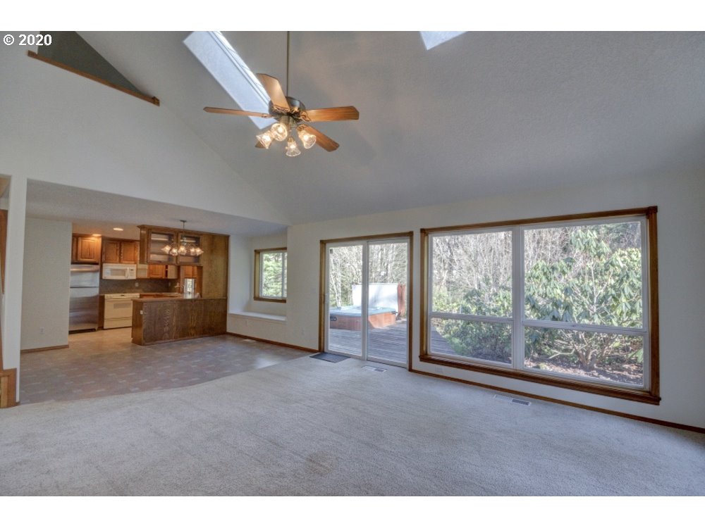 67051 East Barlow Trail Road Rhododendron, OR 97049 - Photo 5 of 32 a view of n empty room with window and fireplace
