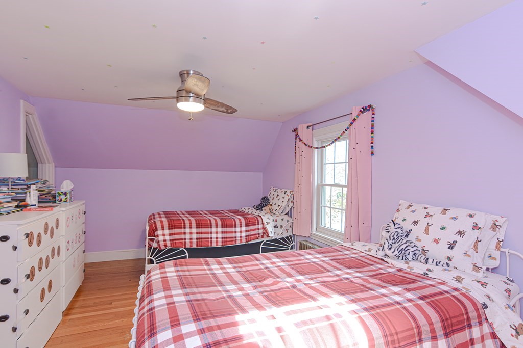 3 Orchard Place Douglas, MA 01516 - Photo 21 of 39 a bedroom with a bed and a chandelier