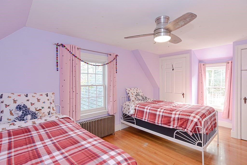 3 Orchard Place Douglas, MA 01516 - Photo 22 of 39 a bedroom with a bed chandelier and a window
