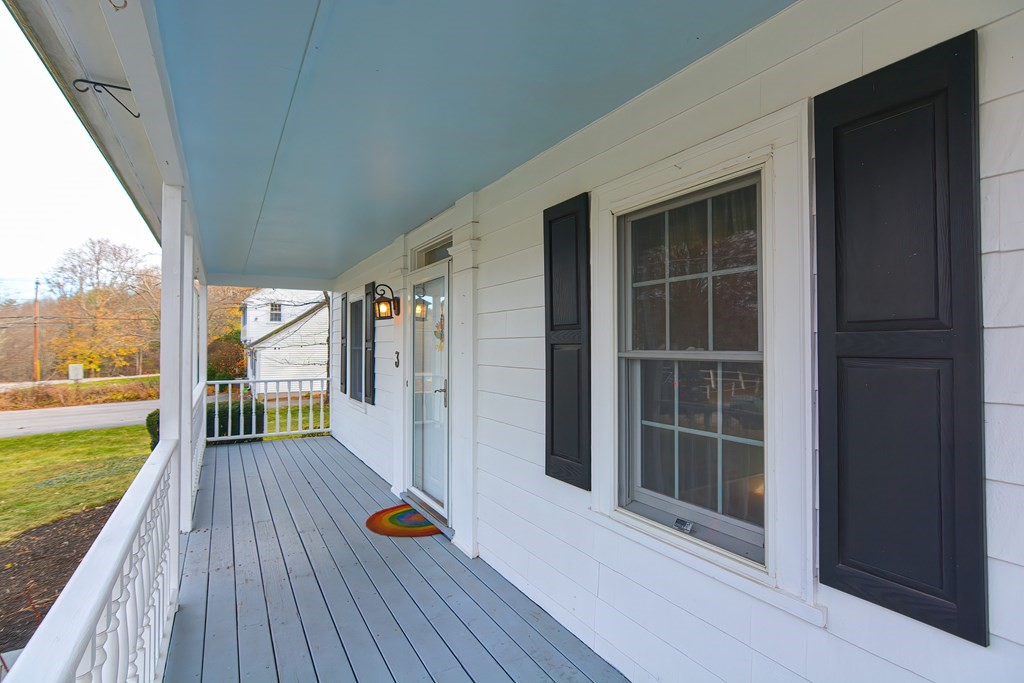 3 Orchard Place Douglas, MA 01516 - Photo 38 of 39 a view of deck with flat screen tv and floor to ceiling window