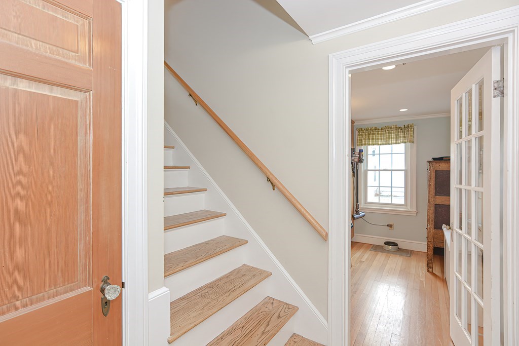 3 Orchard Place Douglas, MA 01516 - Photo 5 of 39 a view of a hallway with wooden floor and entryway