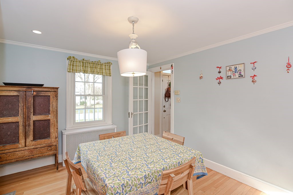 3 Orchard Place Douglas, MA 01516 - Photo 6 of 39 a view of livingroom with kitchen island chandelier and wooden floor
