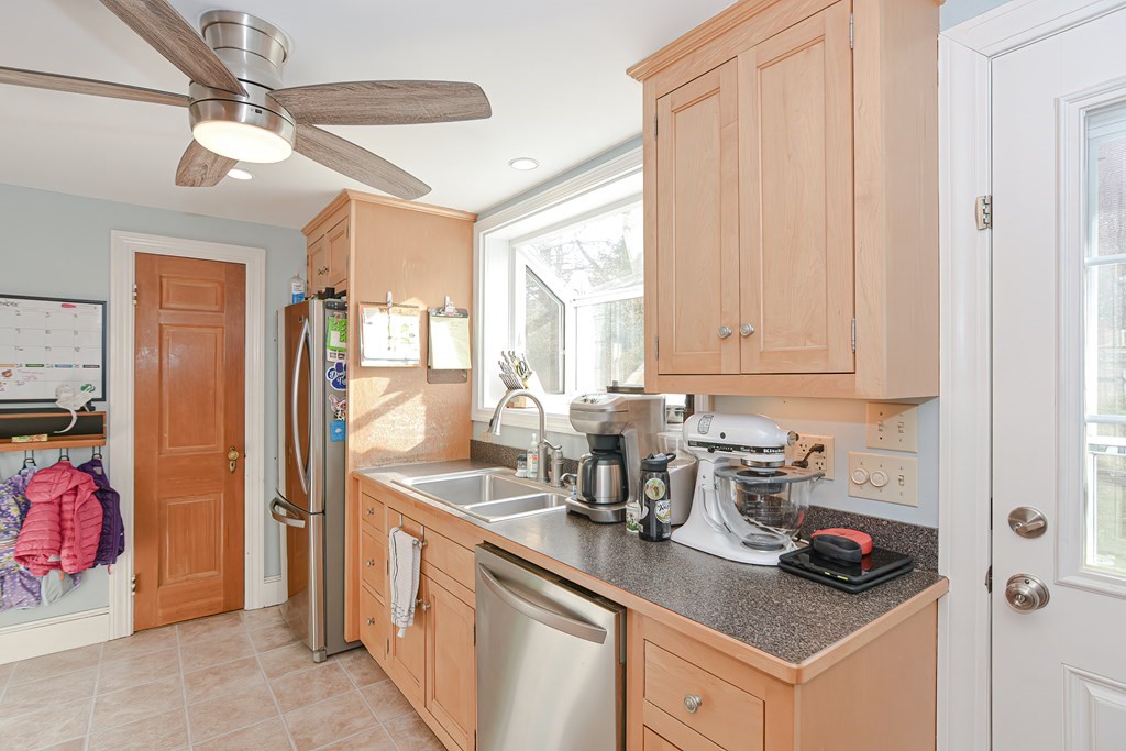 3 Orchard Place Douglas, MA 01516 - Photo 10 of 39 a kitchen with stainless steel appliances a sink a stove and a refrigerator