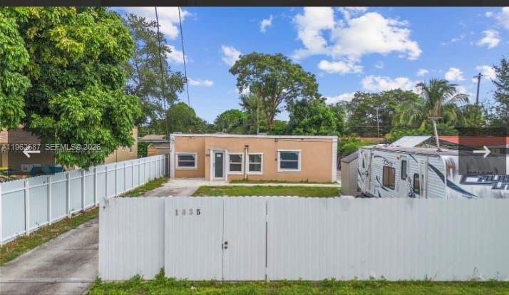 1835 Northwest 85th Street Miami, FL 33147 - Photo 3 of 19 a view of a house with a yard