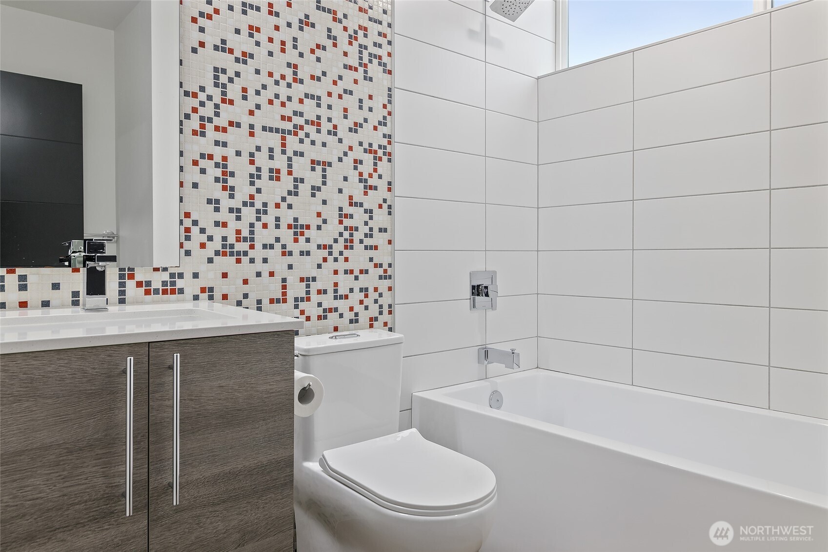 9221 Linden Avenue North, Unit A Seattle, WA 98103 - Photo 12 of 29 a bathroom with a sink toilet and shower