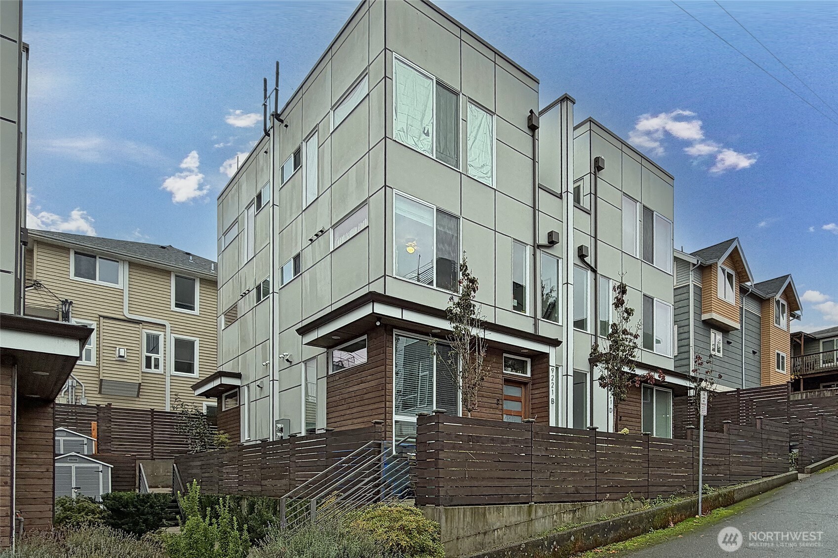9221 Linden Avenue North, Unit A Seattle, WA 98103 - Photo 25 of 29 a view of a big building with many windows