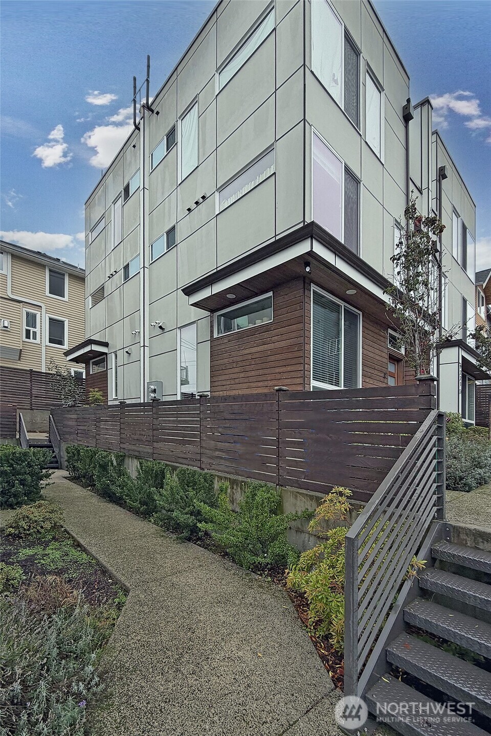 9221 Linden Avenue North, Unit A Seattle, WA 98103 - Photo 26 of 29 a view of a house with a yard