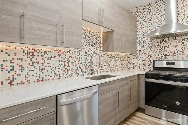 a kitchen with granite countertop cabinets and a stove
