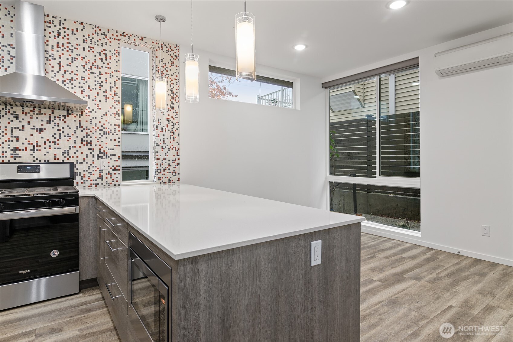 9221 Linden Avenue North, Unit A Seattle, WA 98103 - Photo 9 of 29 a kitchen with a stove and a refrigerator