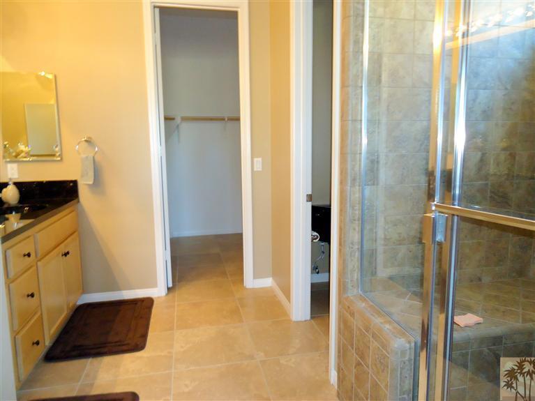 81278 Golden Barrel Way La Quinta, CA 92253 - Photo 11 of 17 a view of walk in closet and bathroom
